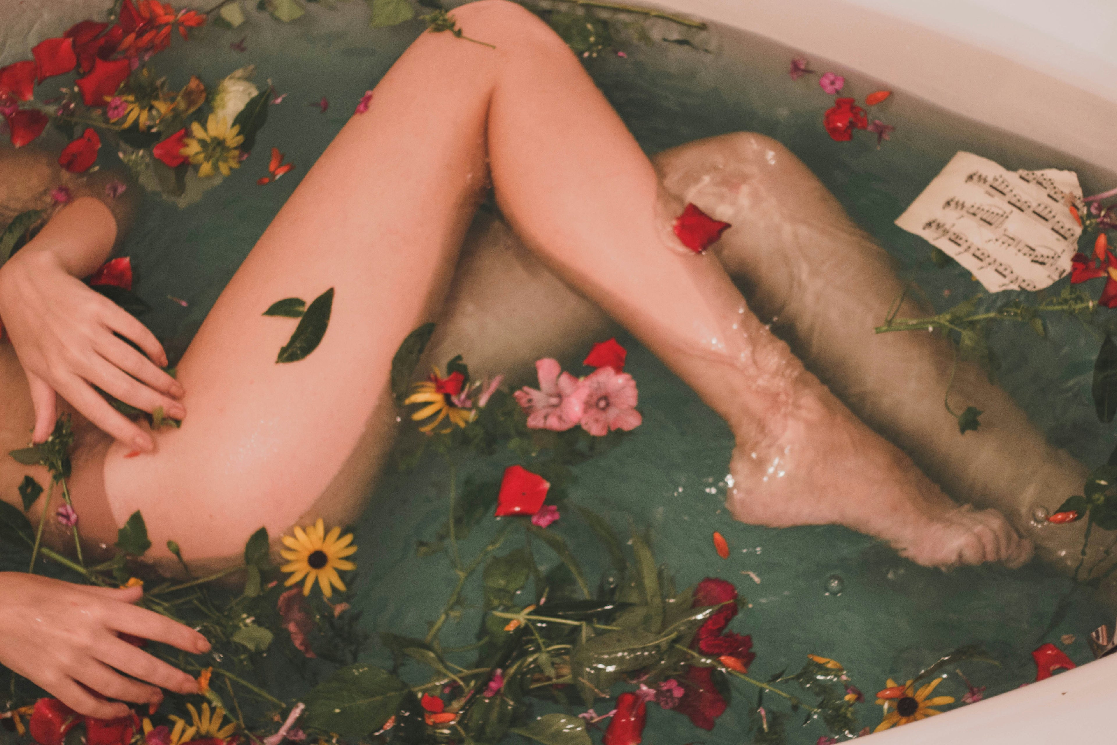 woman in tub with flowers